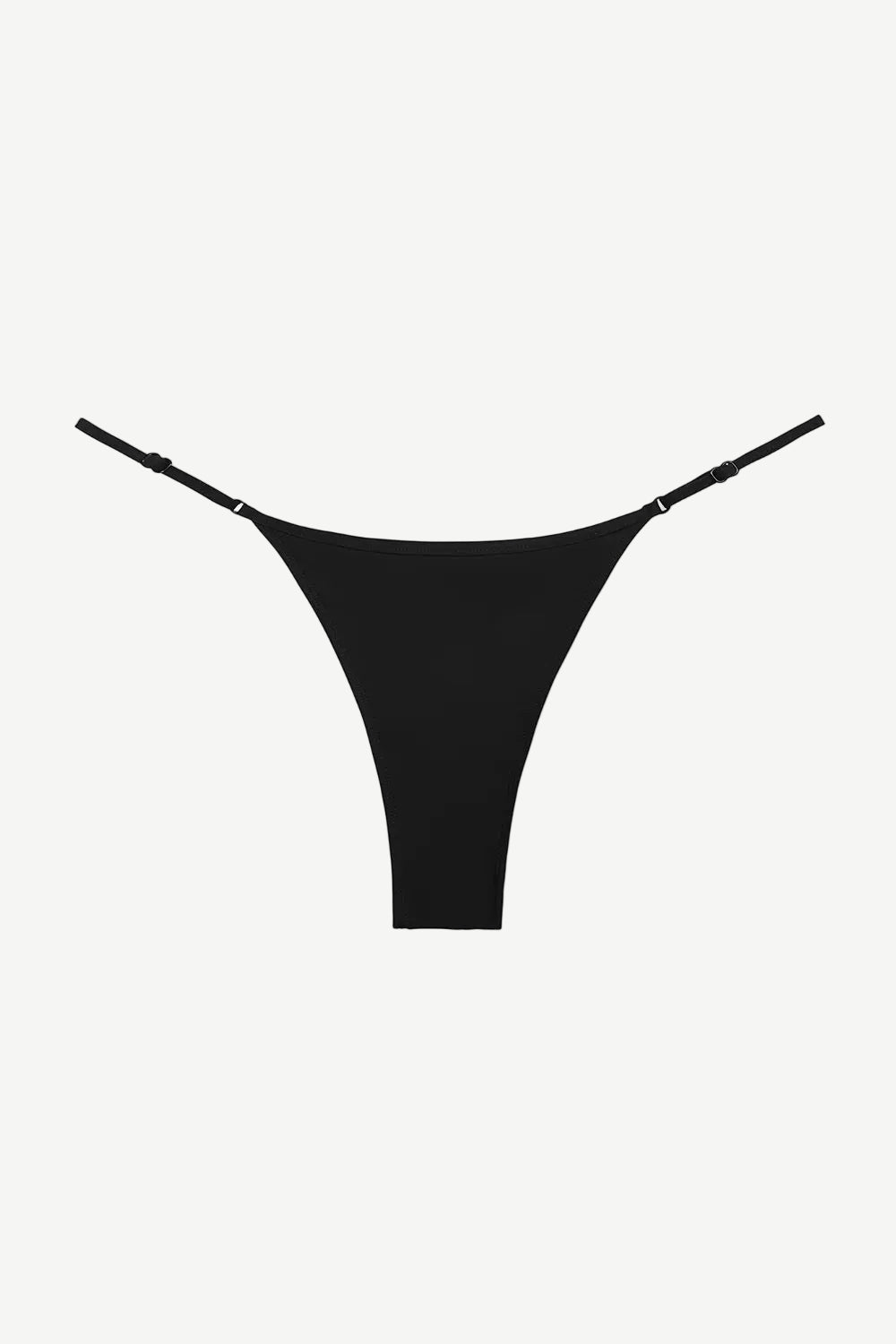 The Luna Bottom is a black low-rise bikini bottom featuring thin adjustable straps and crafted from ECONYL® regenerated nylon, showcased against a white background.