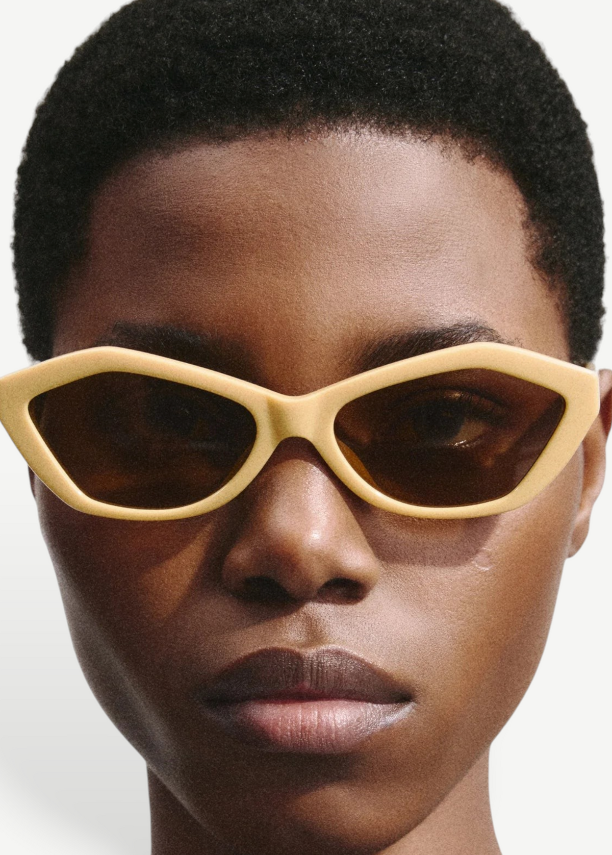 KABE SHOP INC Bambino angular beige acetate sunglasses with tobacco lenses and gold temple details on a model