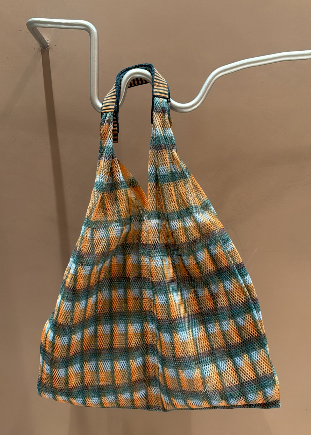 KABE SHOP INC Udaipur bag by ÉPICE featuring a vibrant orange, blue, and white plaid woven mesh fabric