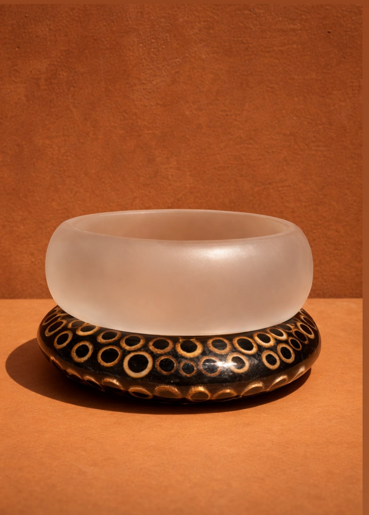 KABE SHOP INC wood and resin bangle set featuring a frosted white resin bracelet stacked on a black patterned wood one