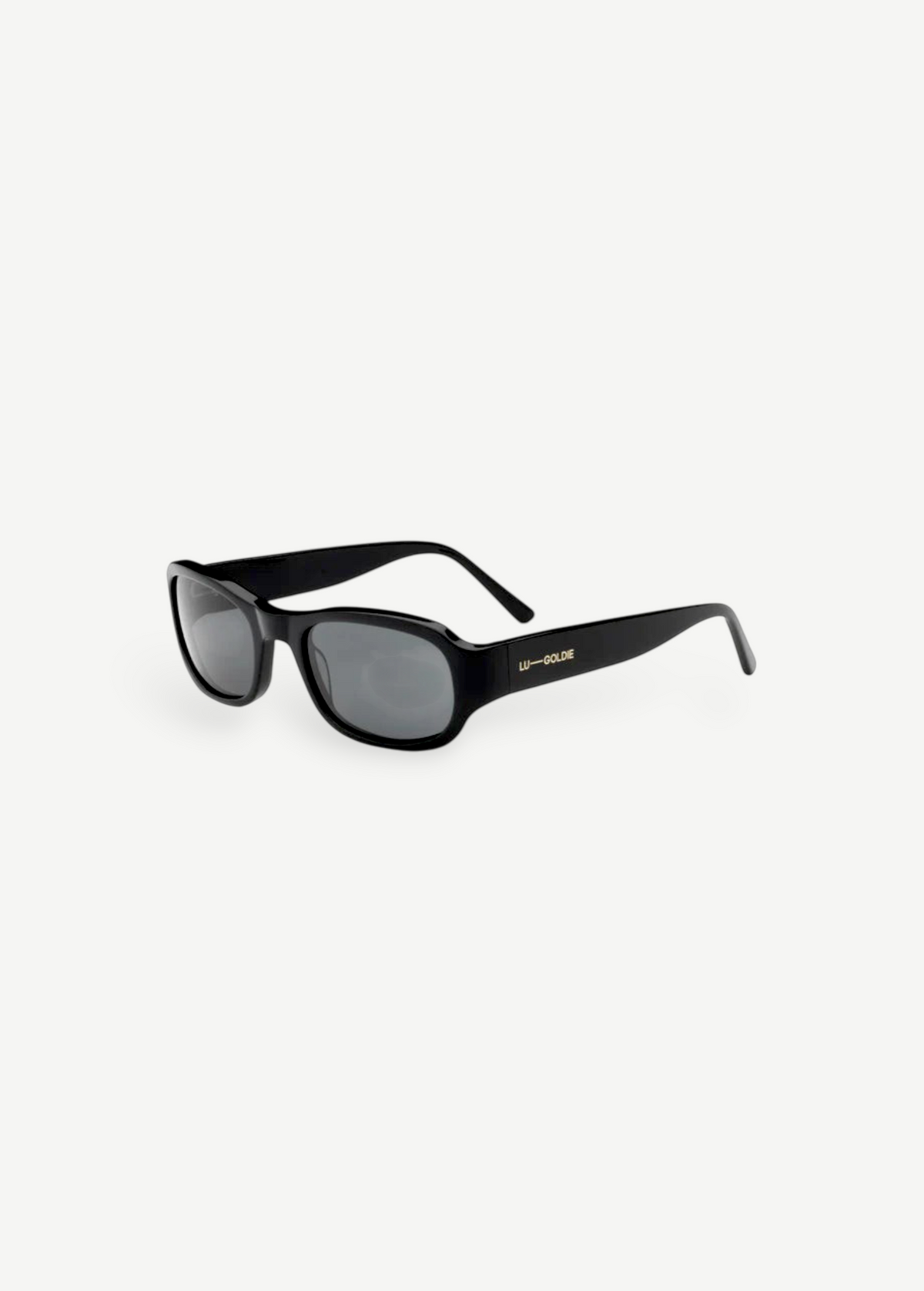 The Jordyn sunglasses are black, rectangular-shaped with thick frames and dark lenses. LU GOLDIE’s name appears in gold lettering on the arms. Displayed against a plain white background, these standout festival sunglasses provide reliable UV protection for sunny days outdoors.