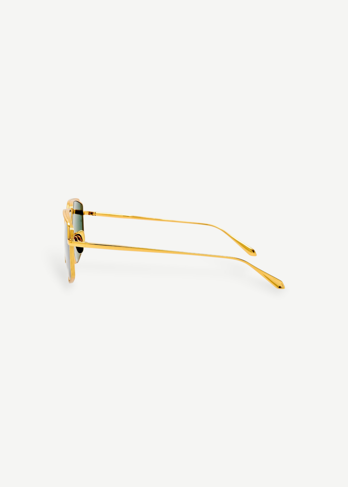 Side view of Miranda Sunglasses, featuring gold-plated frames with green lenses, displayed against a plain white background. The thin Japanese titanium arms are gently curved at the ends, enhancing the modern, sleek look of the oversized design.