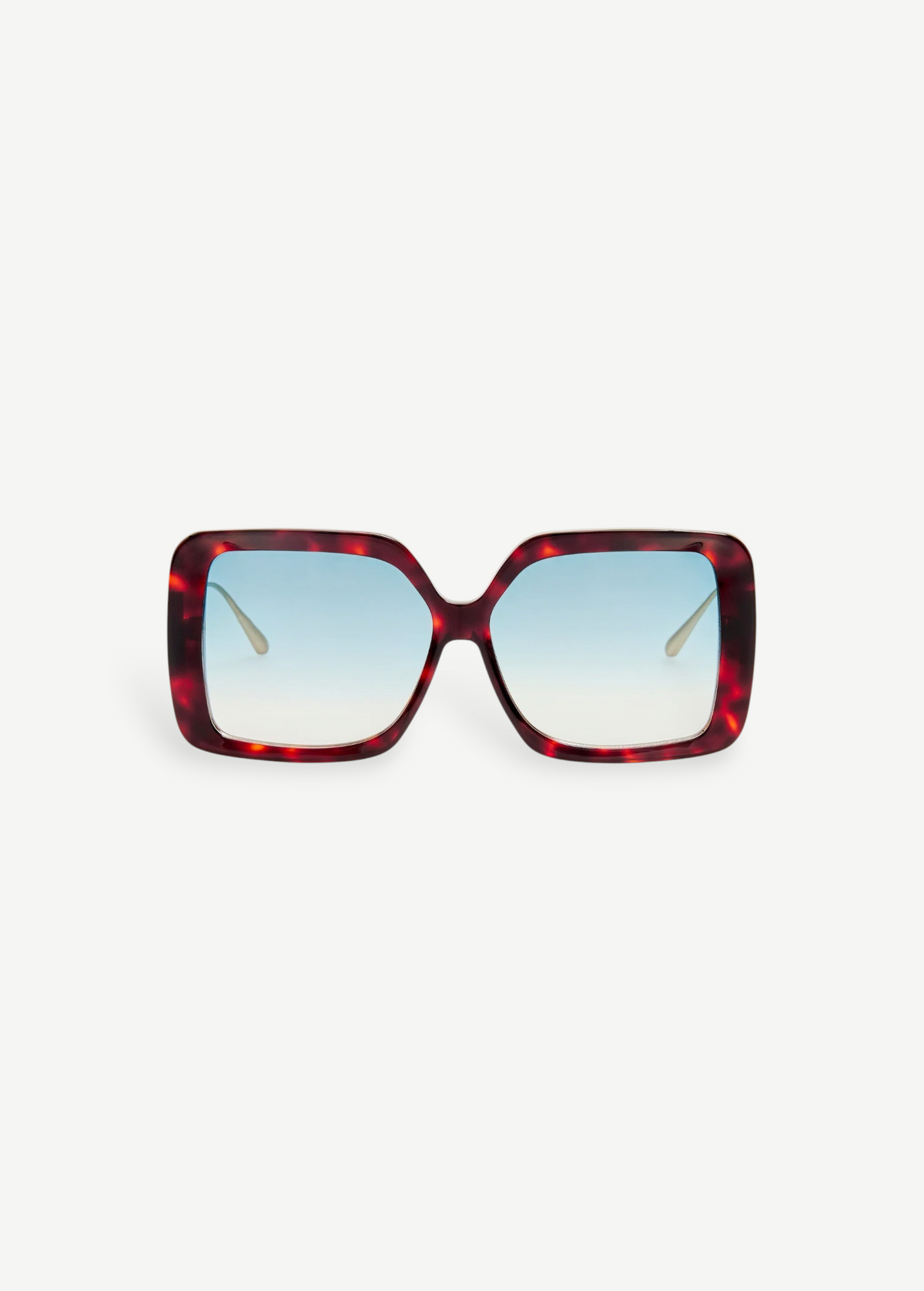 The Macy Sunglasses feature a square, oversized silhouette with a tortoiseshell acetate frame and blue gradient lenses, displayed facing forward against a plain white background.