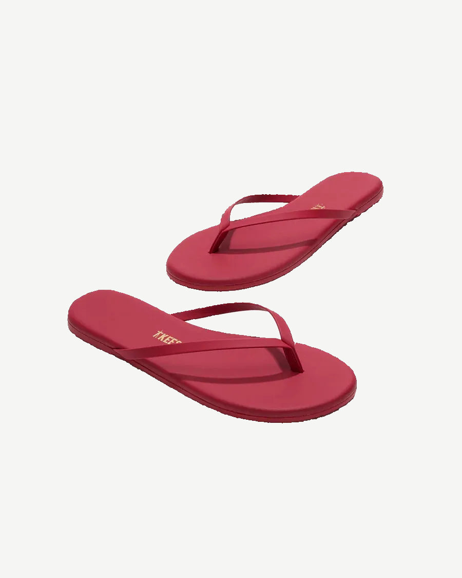 Red flip-flops on a white background