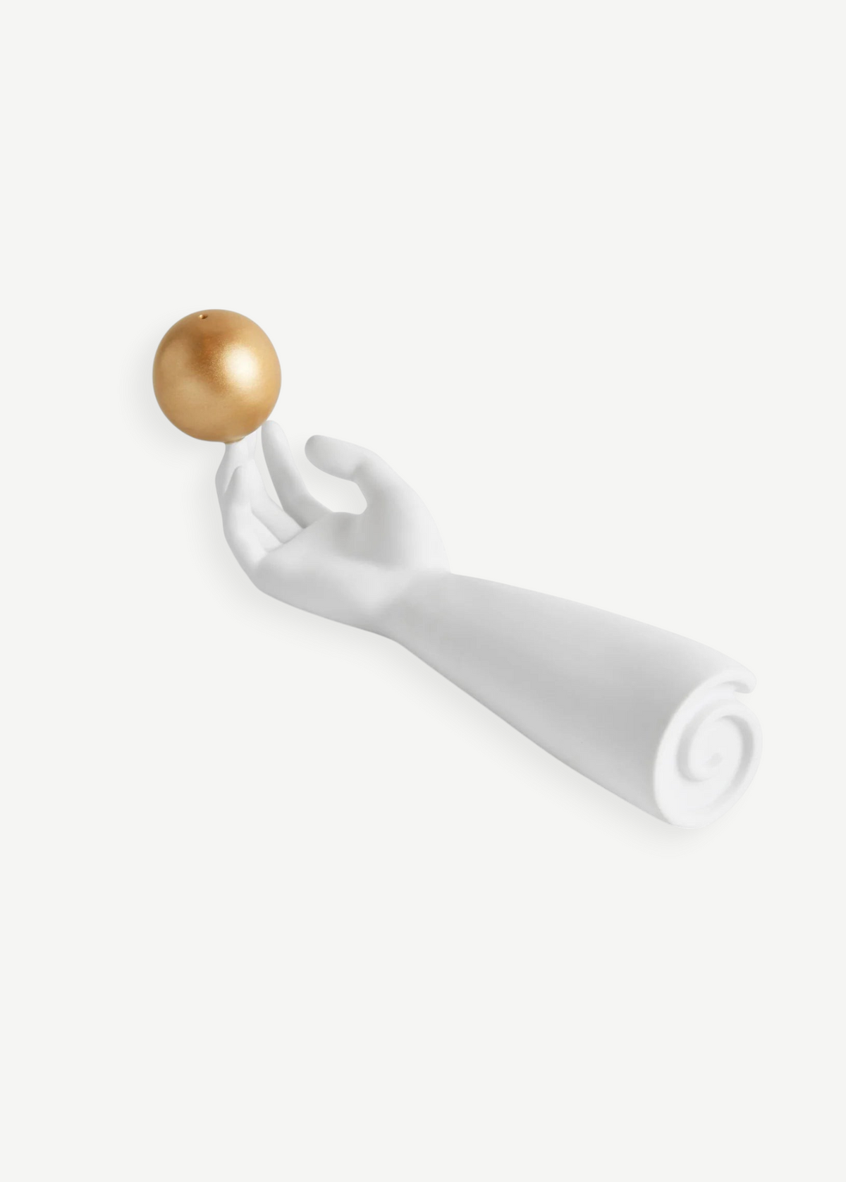 KABE SHOP INC Atlas porcelain incense holder featuring a white sculpted hand balancing a gold sphere on its fingertip.
