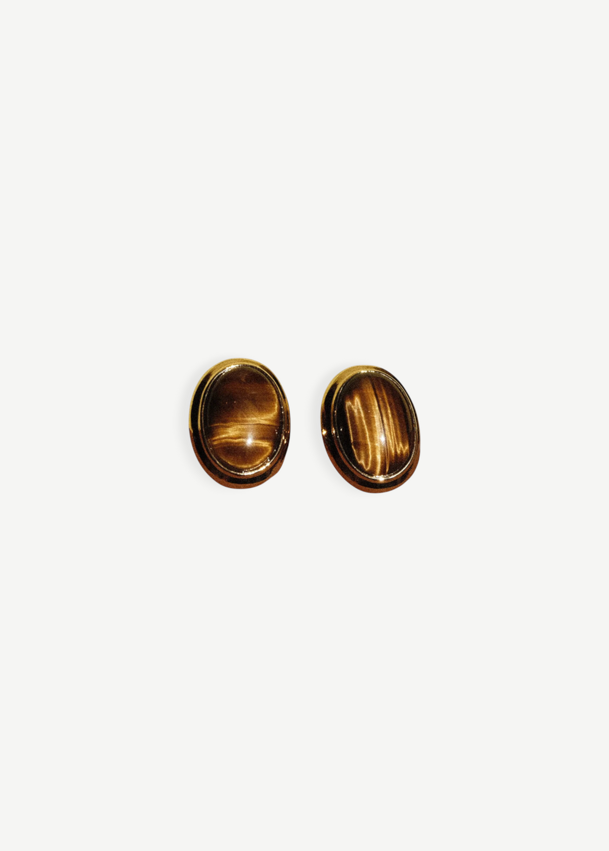 KABE SHOP INC oval cat-eye earrings featuring polished brown tiger eye stones in a vintage-inspired gold setting.