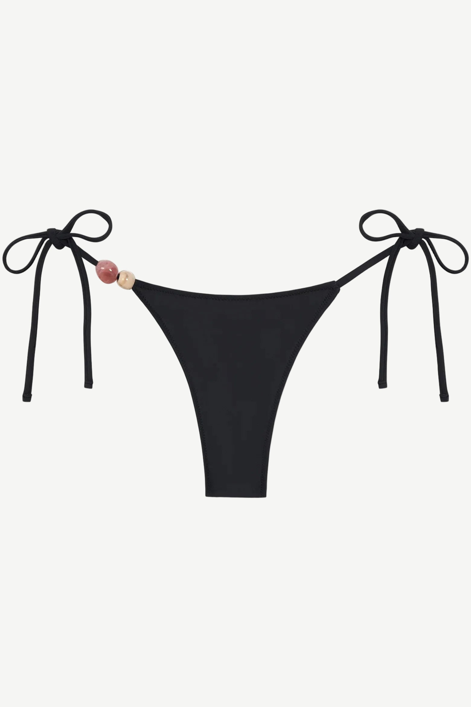 Introducing the Praia Bottom: a black bikini bottom featuring adjustable side ties and two decorative beads—one pink and one beige—on the left. Crafted from recycled polyamide, this minimal, sleek tie-bottom belongs to our eco-friendly swimwear collection, making it an ideal choice for stylish swimmers seeking sustainability.