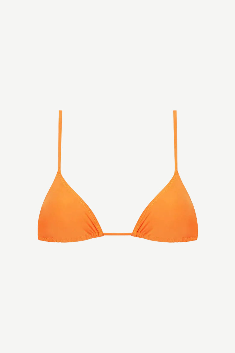 The Equator Top is an orange triangle bikini top featuring thin shoulder straps and a minimal design, shown against a plain white background. This eco-friendly swimwear piece enhances your silhouette and provides UV protection, ensuring confident, carefree days in the sun.