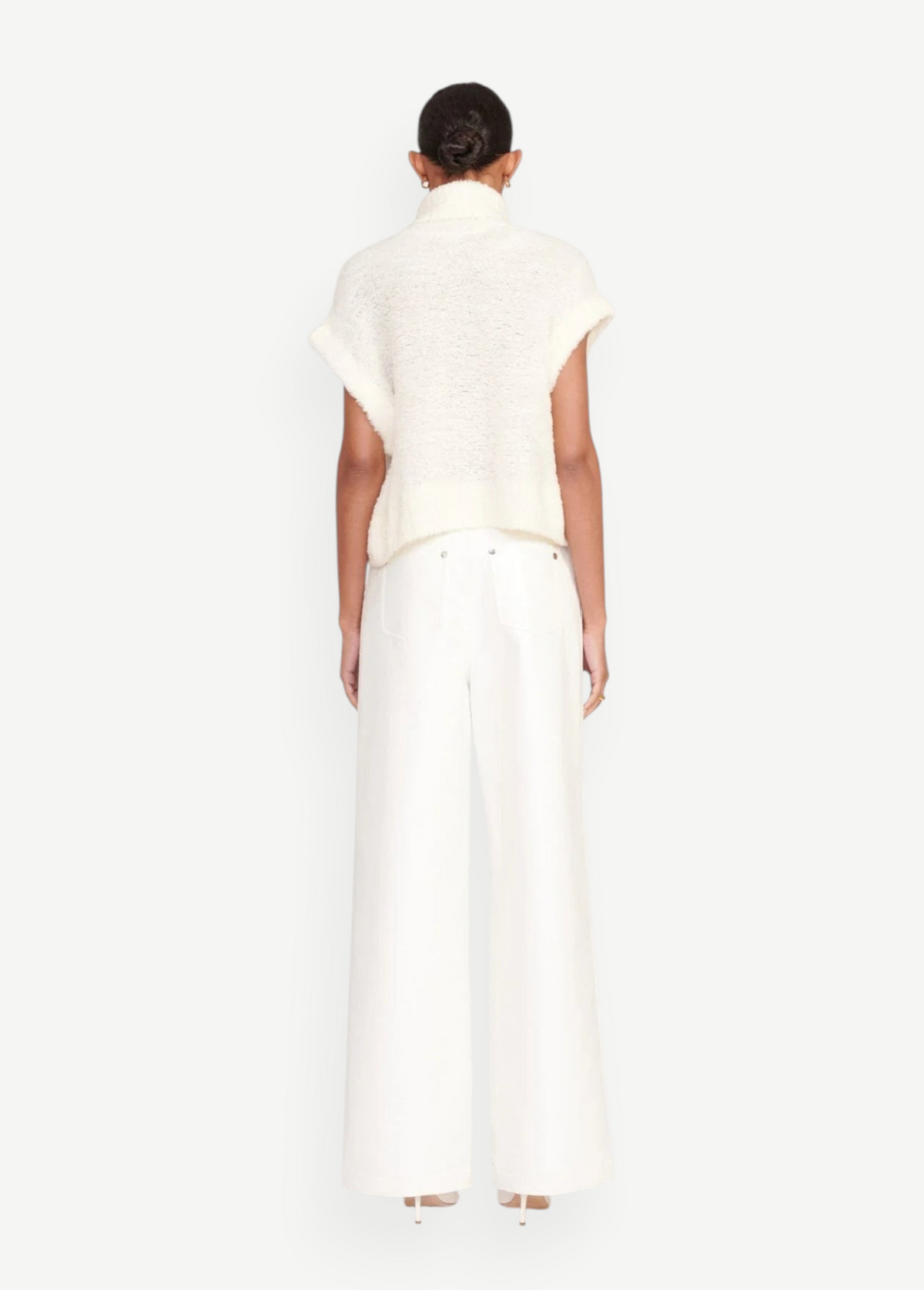 Back view of a model wearing KABE SHOP INC white wide-leg Grayson pants paired with a cream textured knit top