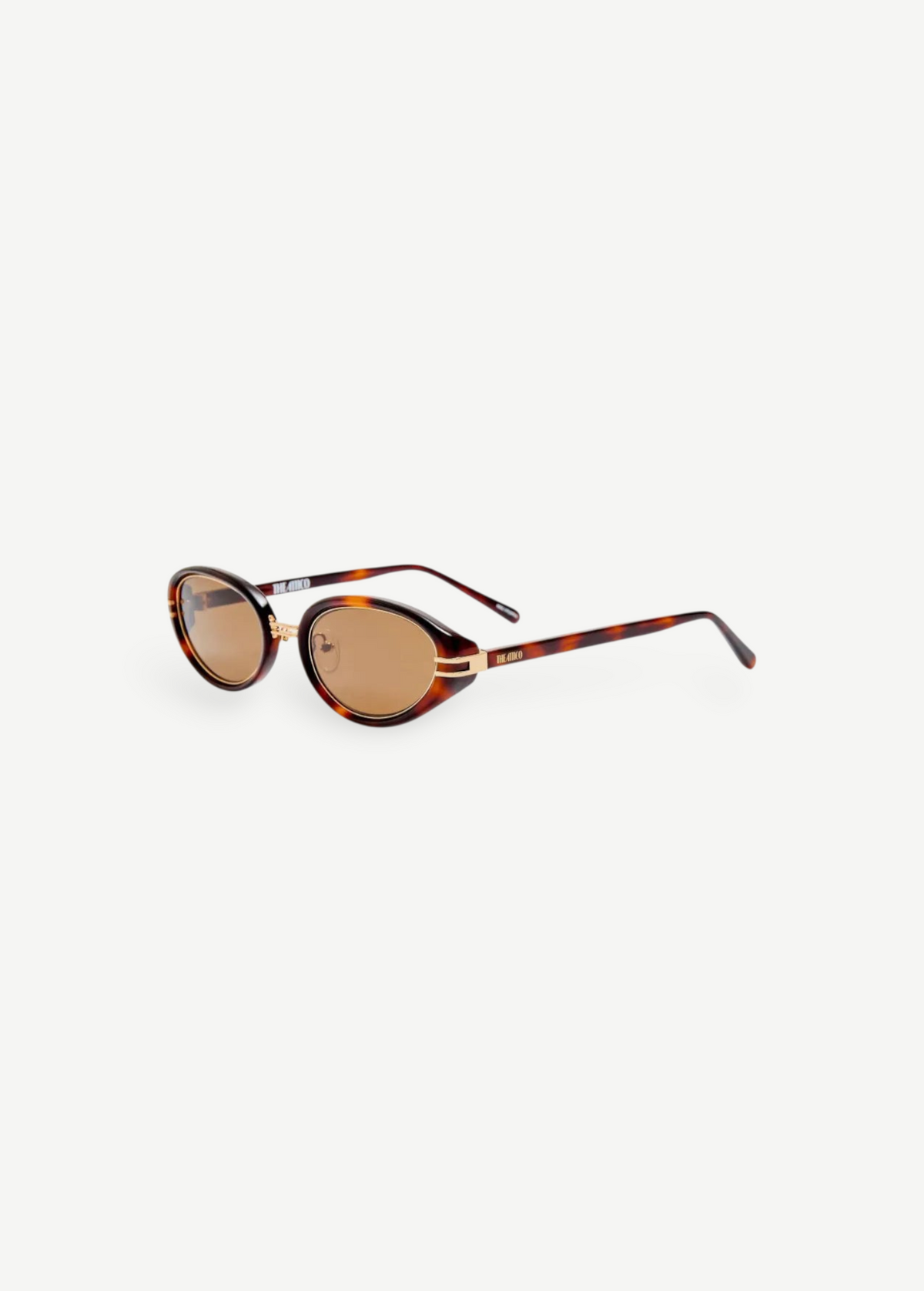 KABE Ambra oval sunglasses featuring a tortoiseshell frame, gold-tone accents, and brown gradient lenses.