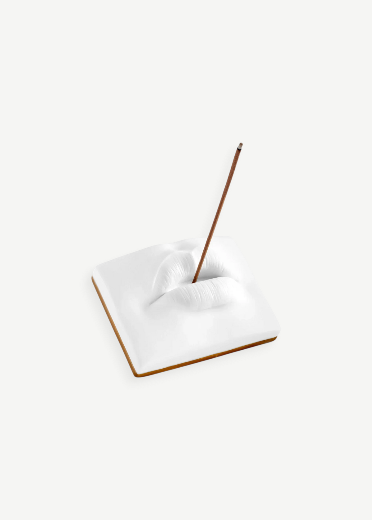 KABE SHOP INC Oh Mon Dieu! white porcelain incense holder featuring a sculptural pair of lips with a burning stick.