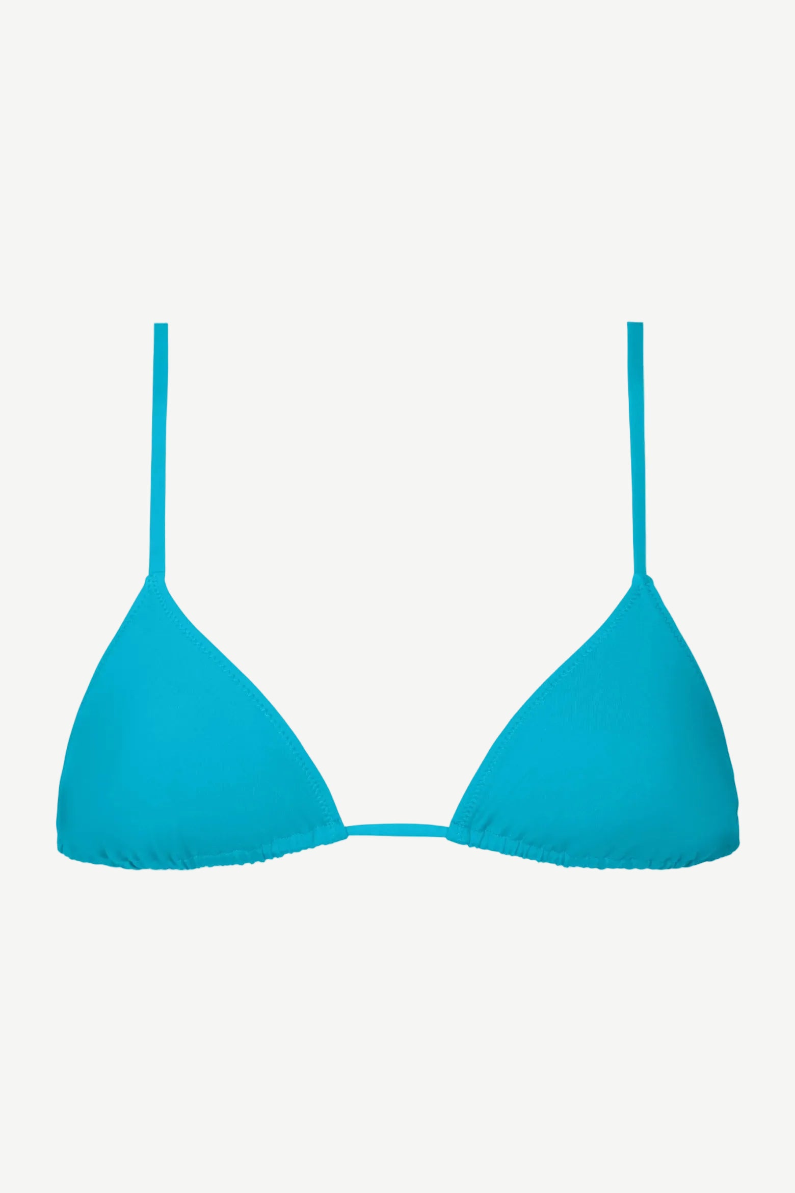 The Equator Top is a bright blue triangle bikini top with thin straps, crafted from eco-friendly ECONYL® regenerated polyamide swimwear fabric, and displayed against a white background.