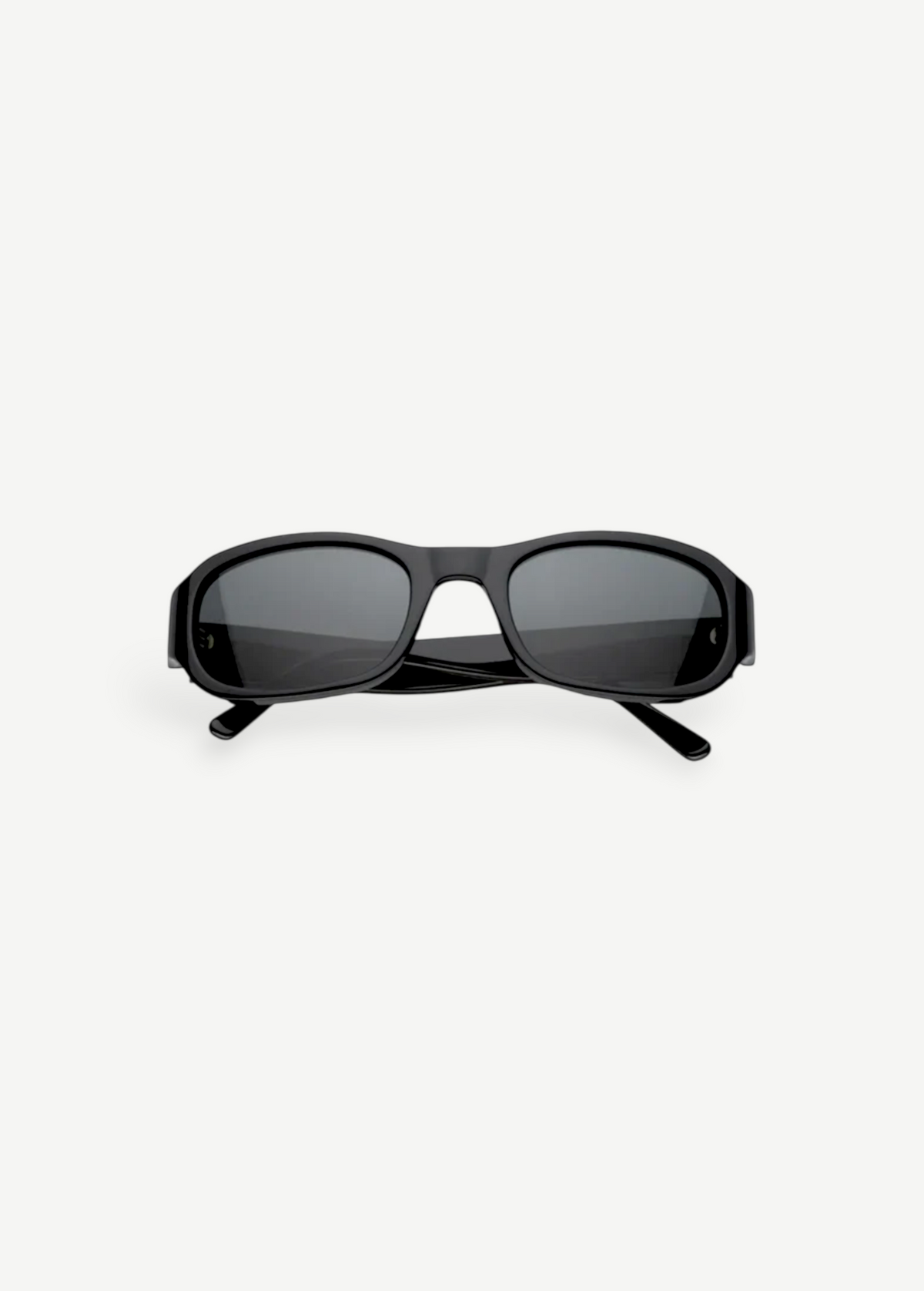 Jordyn rectangular black sunglasses with dark lenses, shown from the front against a plain white background. The crossed arms at the back add style, while Jordyn offers reliable UV protection for sunny days—perfect festival sunglasses.