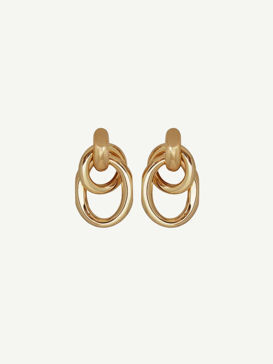 The Ami Earrings are a pair of pierced back earrings, each showcasing three interlocking circular loops, beautifully crafted in 14KT gold plate with an elegant 1.5-inch drop, shown against a plain white background.