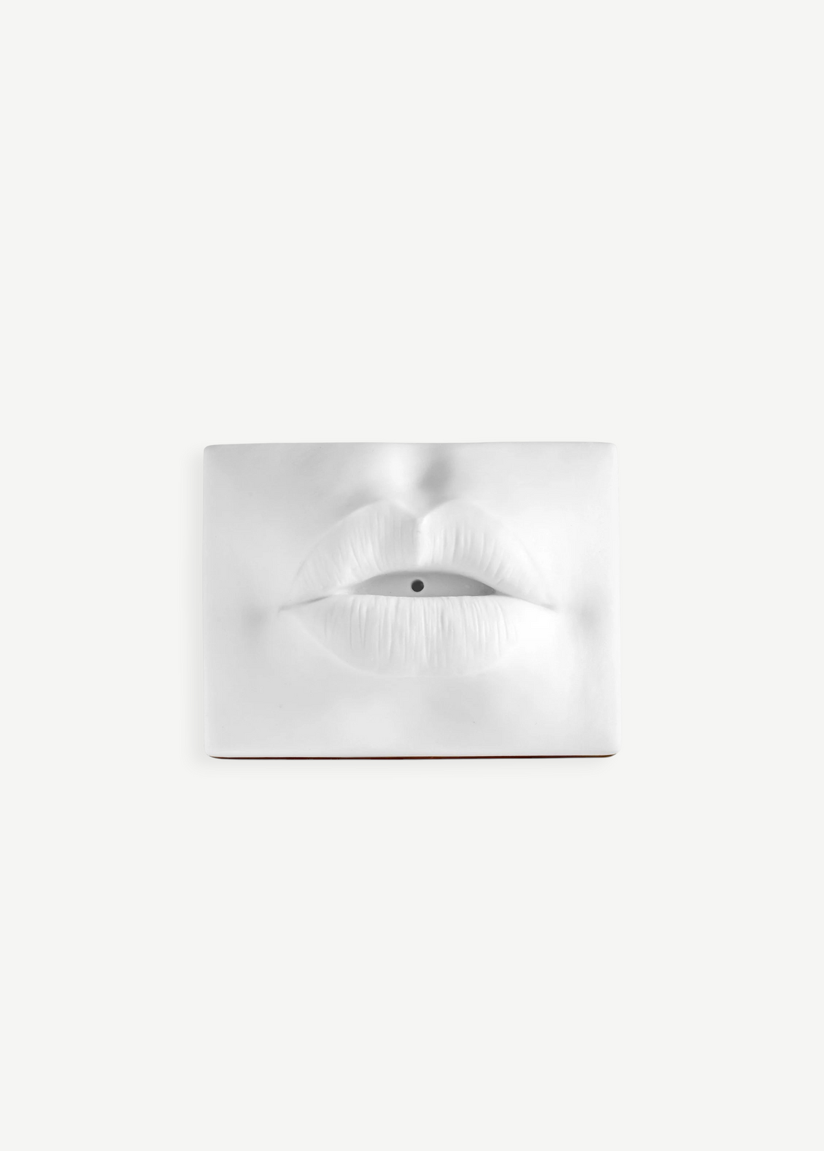 KABE SHOP INC white porcelain incense holder shaped like sculptural lips with a bohemian 1960s Paris aesthetic.