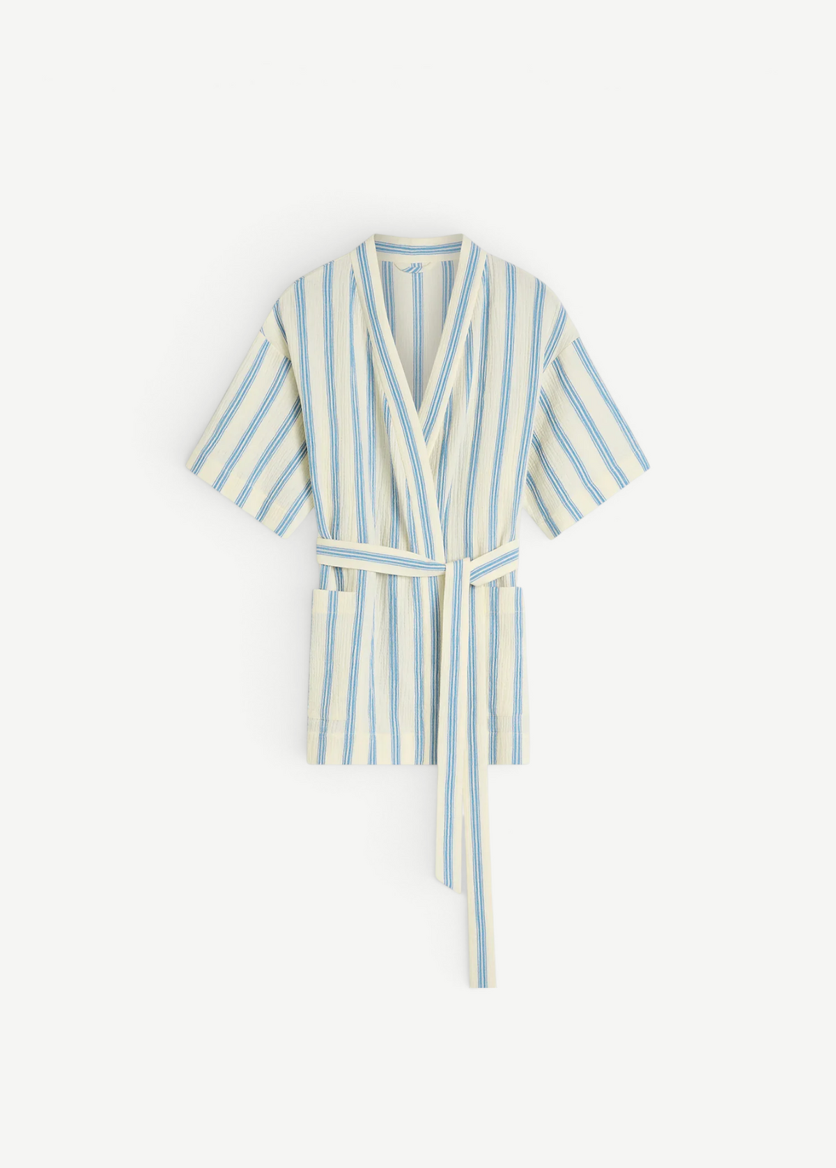 KABE SHOP INC Finn wrap tunic in cream with blue vertical stripes, featuring a belted waist and short sleeves.