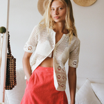 KABE SHOP INC Poolside Top in cream cotton crochet with short sleeves and open-weave floral patterns on a model.
