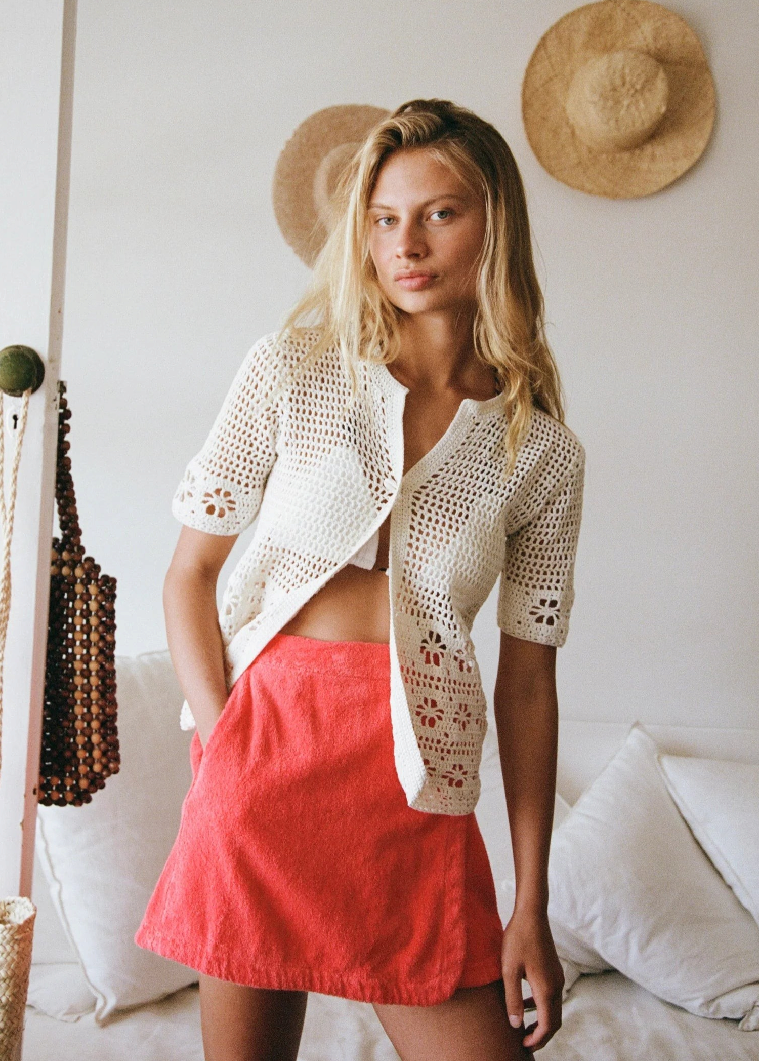 KABE SHOP INC Poolside Top in cream cotton crochet with short sleeves and open-weave floral patterns on a model.