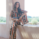 Model wearing KABE SHOP INC Nera shirt featuring an ikat print and crochet details in a relaxed oversized fit