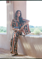 Model wearing KABE SHOP INC Nera shirt featuring an ikat print and crochet details in a relaxed oversized fit