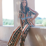 KABE SHOP INC Nera wide leg pants featuring a tribal ikat print in brown and cream tones worn with a matching shirt.