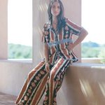 KABE SHOP INC Nera wide leg pants featuring a tribal ikat print in brown and cream, worn with a matching shirt.