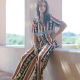 KABE SHOP INC Nera wide leg pants featuring a tribal ikat print in brown and cream, worn with a matching shirt.