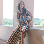 KABE SHOP INC Nera shirt featuring an ikat print and crochet details worn by a model in a relaxed outdoor setting.