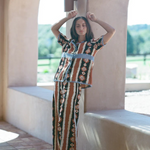 KABE SHOP INC Nera shirt featuring an oversized ikat print with crochet details, worn with matching wide-leg trousers.