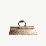 KABE SHOP INC Victoria Bag in metallic rose gold with a unique silver sculptural handle and structured silhouette.