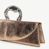 KABE SHOP INC Victoria Bag in metallic rose gold with a unique sculptural silver handle and structured silhouette