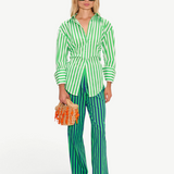 Model wearing KABE SHOP INC Loch Poplin Button Up in green and white stripes with matching striped trousers