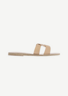 KABE SHOP INC Desmos sandals featuring a minimalist beige leather design with an elegant interlocking strap detail.