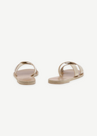 KABE SHOP INC Desmos sandals featuring beige leather interlocking straps and a flat sole for everyday comfort.