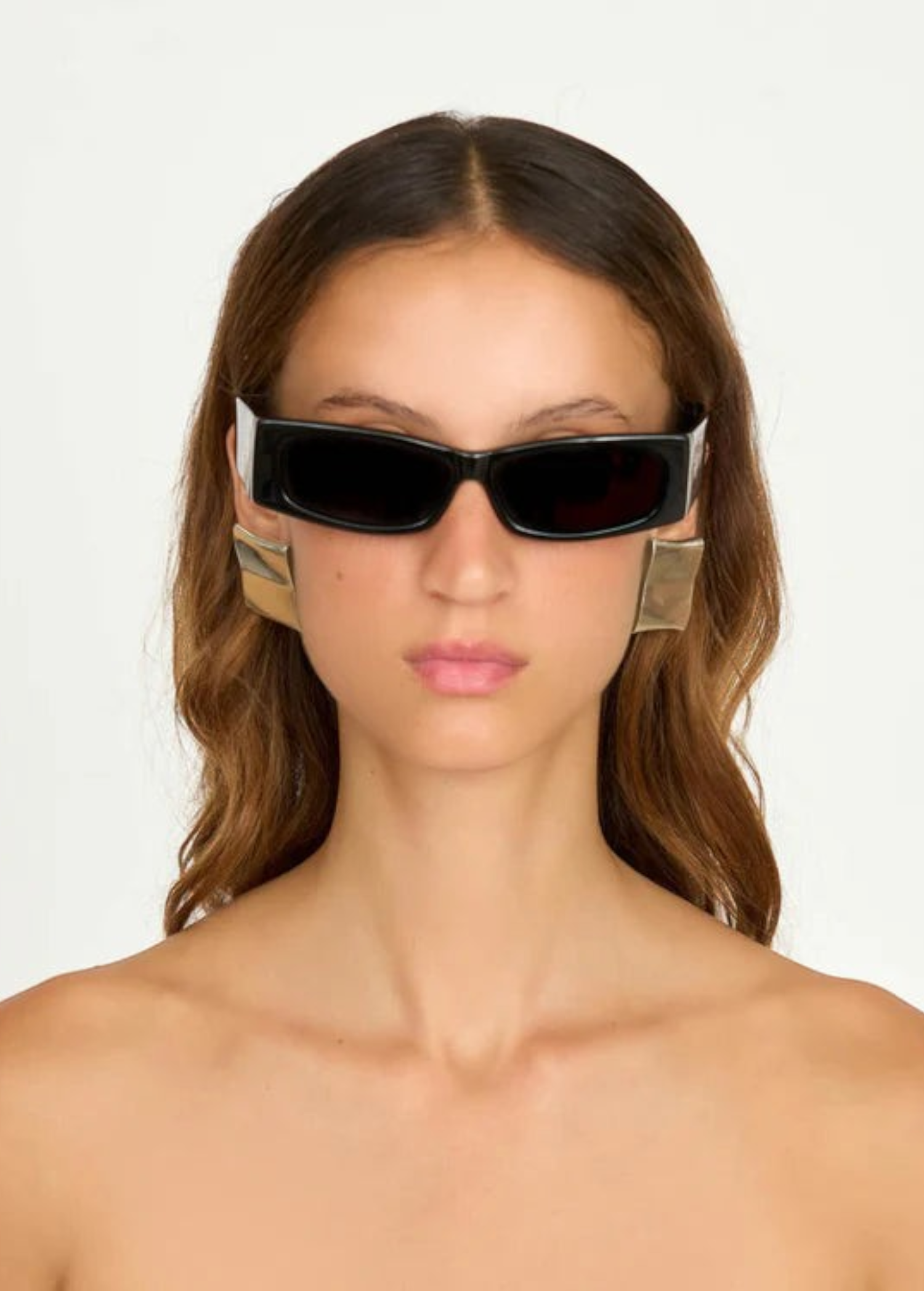 KABE SHOP INC Colbi earrings featuring a bold geometric square design with a sleek silver-plated finish on a model