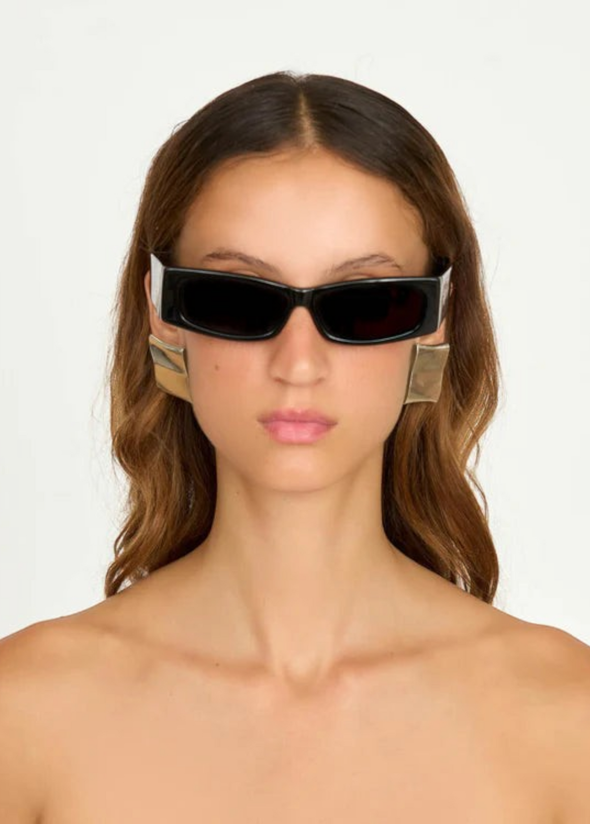 KABE SHOP INC Colbi earrings featuring a bold geometric square design with a sleek silver-plated finish on a model
