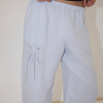 Light blue, straight-leg Deiji Studios Eyelet Pant with a drawstring eyelet detail on the right thigh.