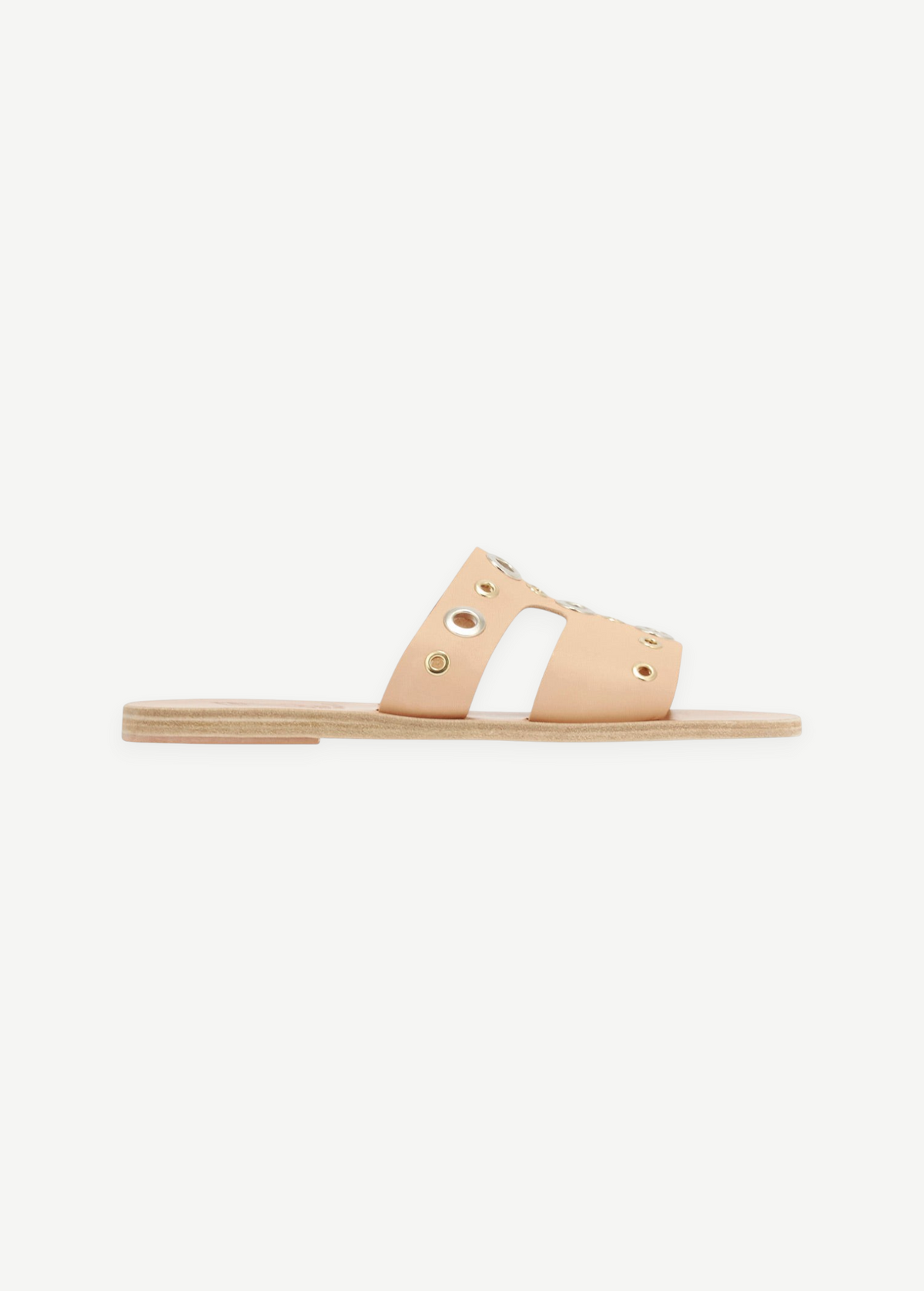 KABE SHOP INC Apteros slide sandals in beige leather with metallic eyelet hardware details on a flat sole.