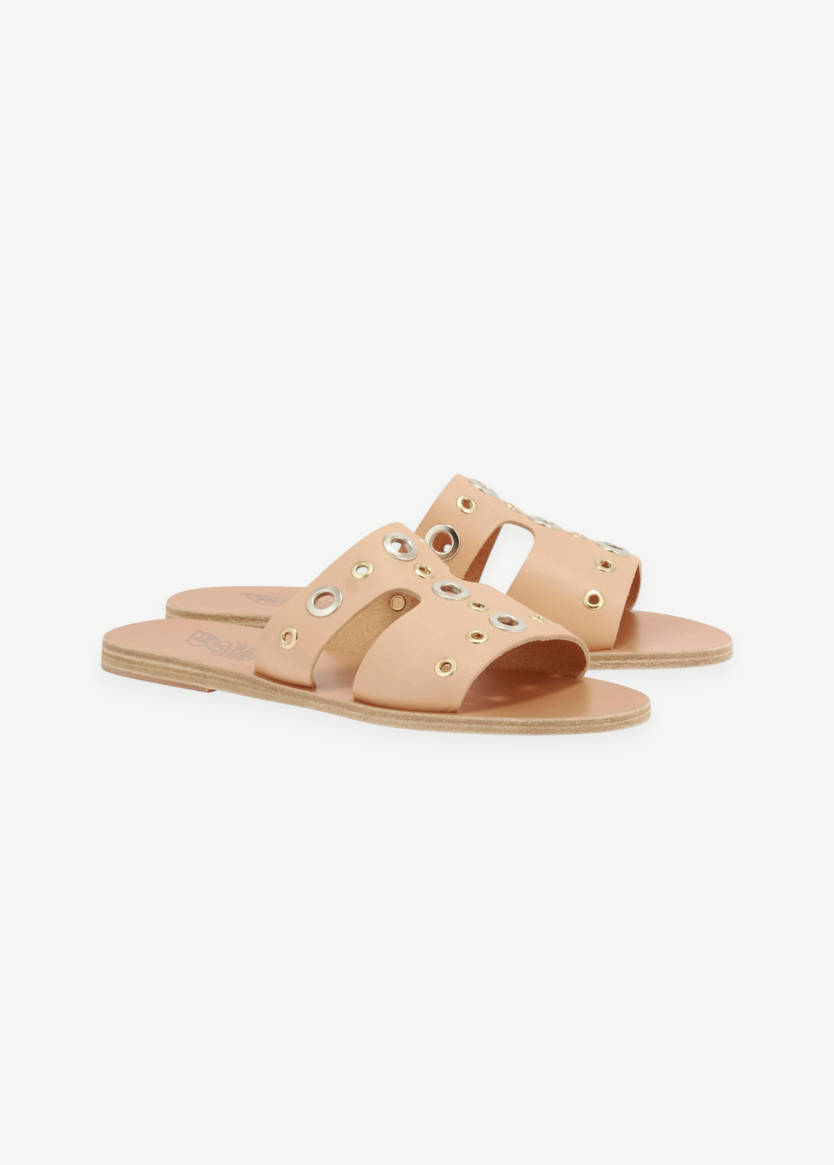 KABE SHOP INC Apteros slide sandals in beige leather with mixed metallic eyelet hardware details.