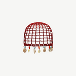 KABE SHOP INC Zahi Hat, a red crocheted skullcap featuring a grid pattern and dangling seashell and stone charms.