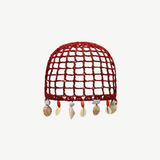 KABE SHOP INC Zahi Hat, a red crocheted skullcap featuring a grid pattern and dangling seashell and stone charms.