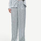 Sage green Nami Pant featuring a high-waisted, wide-leg design with a textured, crinkled finish in a relaxed silhouette.