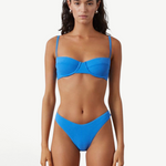KABE SHOP INC ocean blue textured bikini brief with a high-cut leg and curved waistline on a model