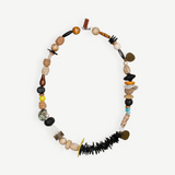 KABE SHOP INC Tesoro necklace featuring eclectic mixed beads of wood, coconut, seashell, resin, and stone with a clasp.