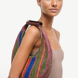 KABE SHOP INC Moon Tote bag featuring a multi-colored striped woven design with a brown leather shoulder strap