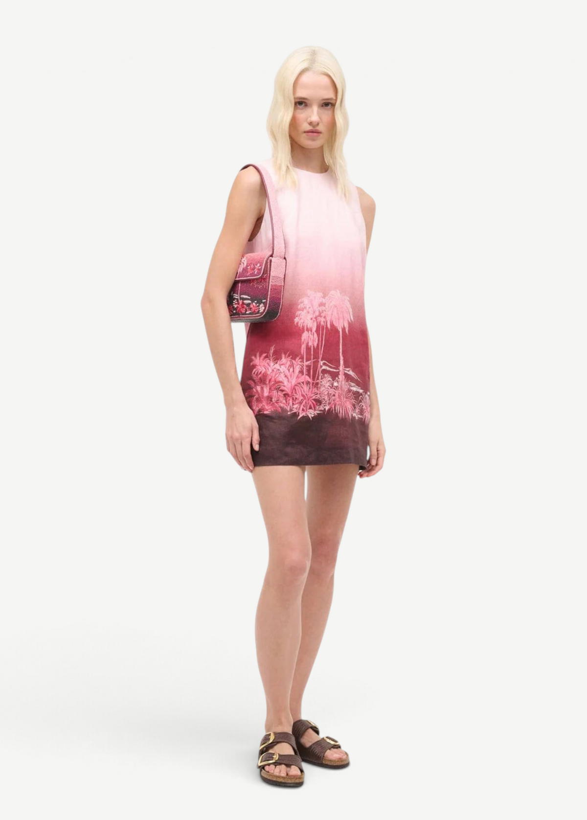 Model wearing a KABE SHOP INC Tommy beaded bag with a California-inspired print paired with a matching ombre dress