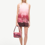 KABE SHOP INC Tommy beaded shoulder bag with pink California palm tree print held by a model in a matching dress