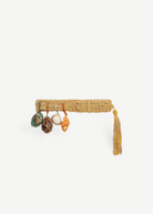 KABE SHOP INC Jibe belt in natural woven straw with detachable decorative seashells and a hanging tassel detail
