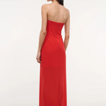 A person viewed from behind wearing the floor-length red Liliana Dress, a strapless gown perfect for special occasions.