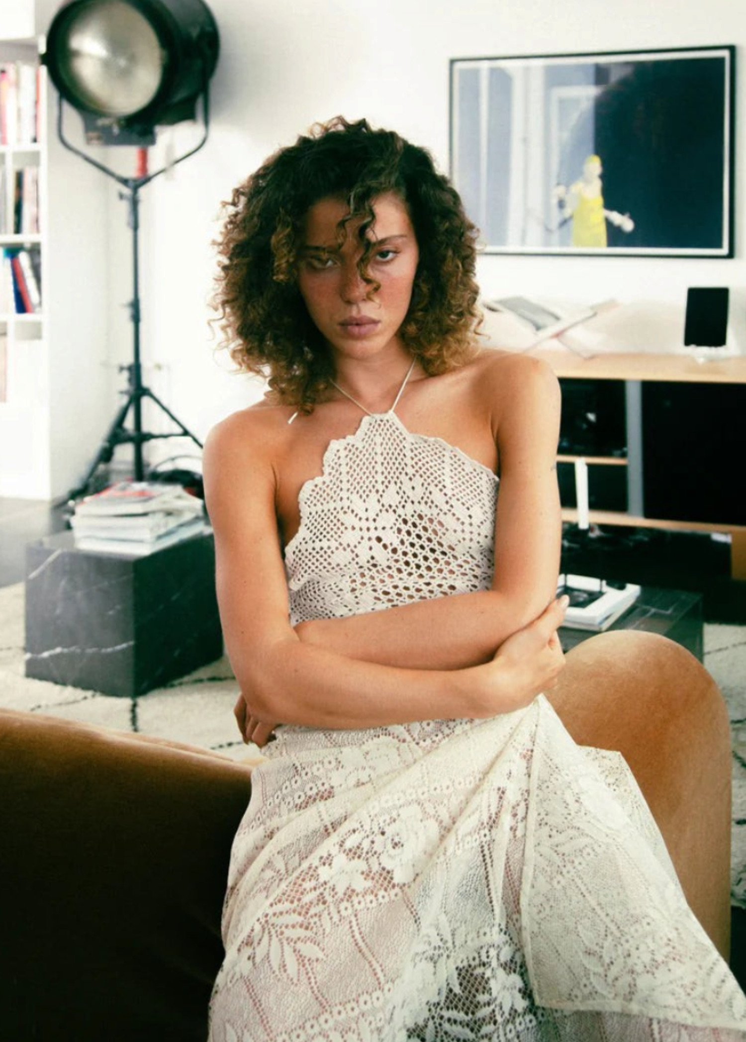 KABE SHOP INC upcycled vintage lace handkerchief dress with halter neck worn by a woman in a modern interior